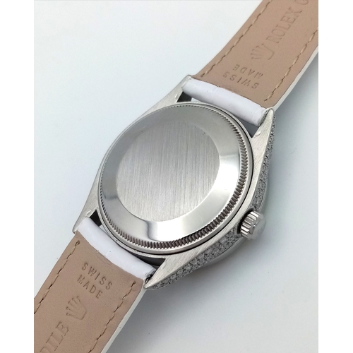 46 - A Custom Rolex Datejust with a Diamond-Paved Dial. White leather strap. Stainless steel case - 36mm.... 