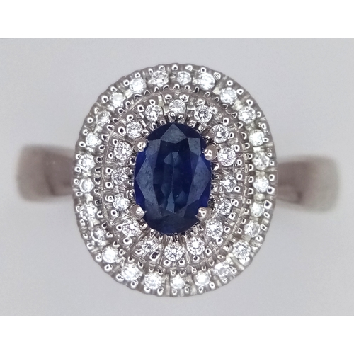 12 - AN 18K WHITE GOLD, DIAMOND AND SAPPHIRE RING. 6.6G, SIZE M 1/2. SC 3068.
