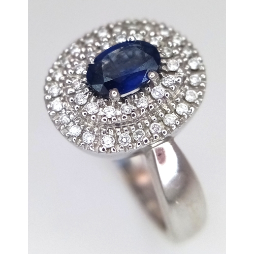 12 - AN 18K WHITE GOLD, DIAMOND AND SAPPHIRE RING. 6.6G, SIZE M 1/2. SC 3068.