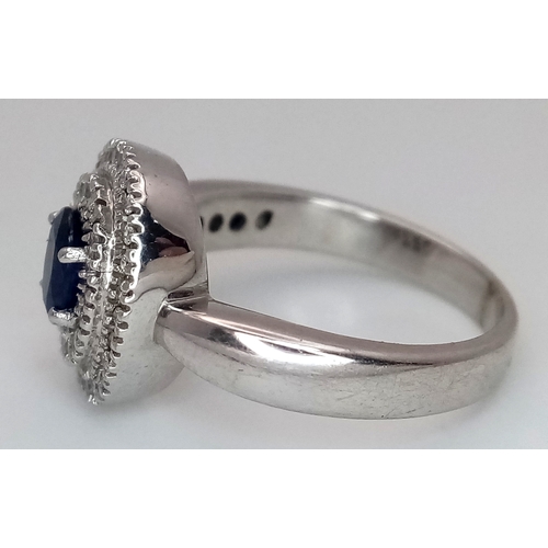 12 - AN 18K WHITE GOLD, DIAMOND AND SAPPHIRE RING. 6.6G, SIZE M 1/2. SC 3068.