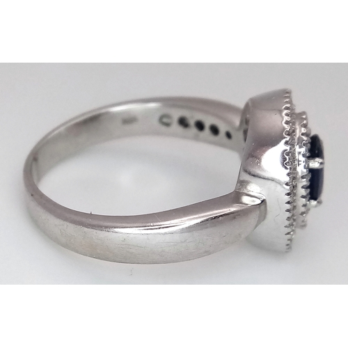 12 - AN 18K WHITE GOLD, DIAMOND AND SAPPHIRE RING. 6.6G, SIZE M 1/2. SC 3068.