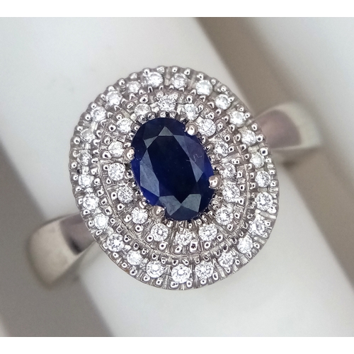 12 - AN 18K WHITE GOLD, DIAMOND AND SAPPHIRE RING. 6.6G, SIZE M 1/2. SC 3068.