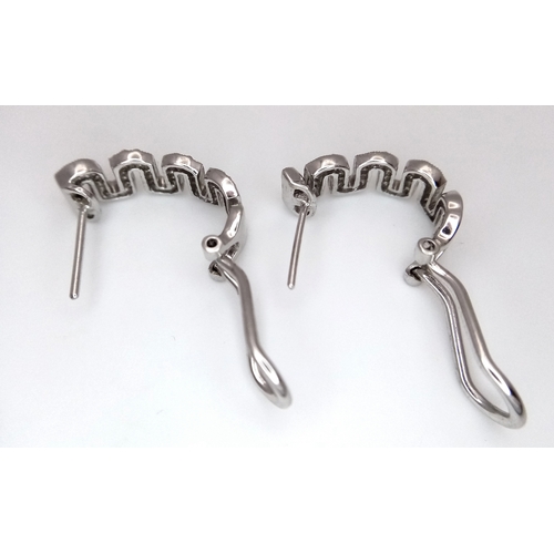 26 - A PAIR OF 18K WHITE GOLD, DIAMOND SET, MIU MIU STYLE, EARRINGS. 0.25 TCW, 5.2G. SC 3091.
