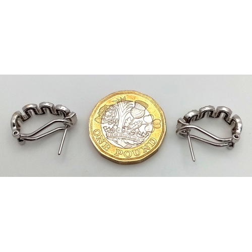 26 - A PAIR OF 18K WHITE GOLD, DIAMOND SET, MIU MIU STYLE, EARRINGS. 0.25 TCW, 5.2G. SC 3091.