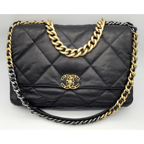 A Chanel Black Quilted Leather Classic Flap Shoulder Bag. Black quilted leather exterior with gold-toned hardware, chain and leather shoulder strap and CC turn-lock flap closure. Burgundy leather interior with a main compartment and a zipped inner pocket. In very good condition overall.  Approx 36cm length x 25cm height x 10cm depth. Comes with a card of authenticity, an original box and dust cover. Please see photos or request a condition report.    STK019681