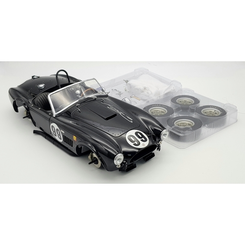 A limited edition, 1 of 50, GMP Shelby Cobra 289 factory team car. 1/12 scale. signed on the bonnet by Dan Gurney. This is a highly detailed model of the 1963 Bridgehampton winner driven by Dan Gurney. In excellent condition, complete with C.O.A. all parts, paperwork and box.