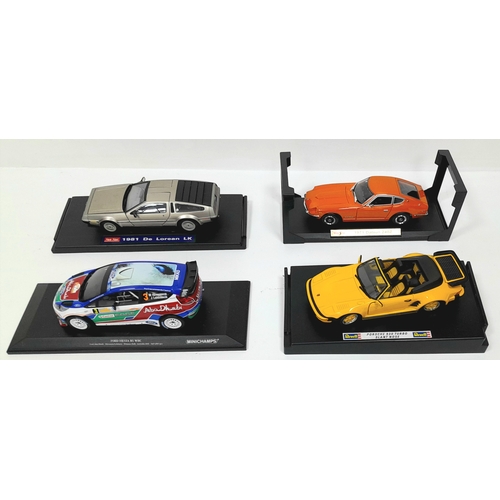 Four boxed 1/18th scale die cast model cars. To include Revell, Maitso, Sun star and Minichamps. Some wear to boxes. Please see photos for condition.