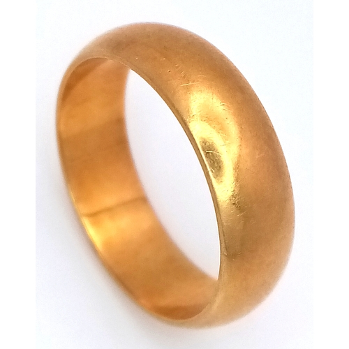 An 18K Yellow Gold Band Ring. UK hallmarks. 6mm width. Size O. 6.4g.