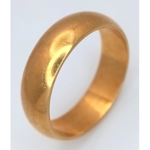 8 - An 18K Yellow Gold Band Ring. UK hallmarks. 6mm width. Size O. 6.4g.