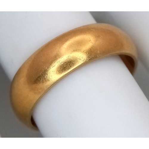 8 - An 18K Yellow Gold Band Ring. UK hallmarks. 6mm width. Size O. 6.4g.