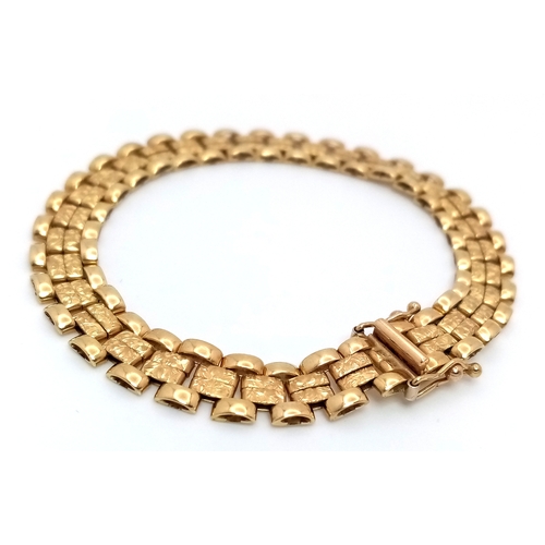 11 - An Italian Tank-Track Link Bracelet. Clip open design. Good condition. 16cm. 11.75g.