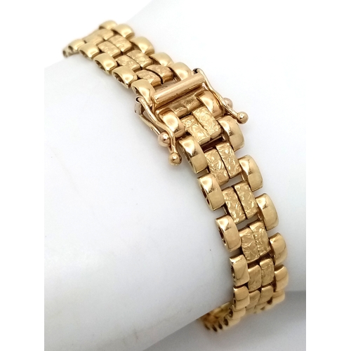 11 - An Italian Tank-Track Link Bracelet. Clip open design. Good condition. 16cm. 11.75g.