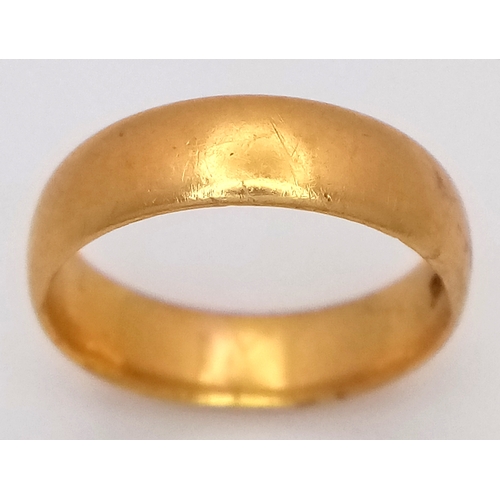 15 - A 22K Yellow Gold Band Ring. 6mm width. Size J. 4.75g.