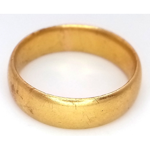15 - A 22K Yellow Gold Band Ring. 6mm width. Size J. 4.75g.