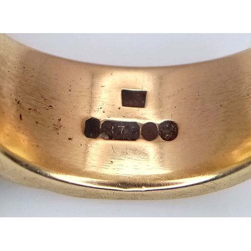 17 - A 9K Yellow Gold Band Ring in Belt Form. Size K 1/2. 5.51g.