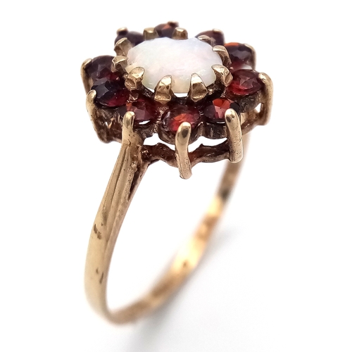 21 - Vintage 9 CARAT GOLD, OPAL and GARNET RING. Full UK hallmark. 2.0 Grams. Size N 1/2.