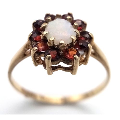 21 - Vintage 9 CARAT GOLD, OPAL and GARNET RING. Full UK hallmark. 2.0 Grams. Size N 1/2.