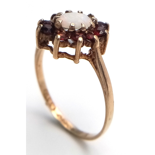 21 - Vintage 9 CARAT GOLD, OPAL and GARNET RING. Full UK hallmark. 2.0 Grams. Size N 1/2.