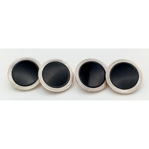 27 - A Pair of 14k Gold and Black Onyx Cufflinks in Circular Form. 8.67g total weight.