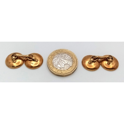 27 - A Pair of 14k Gold and Black Onyx Cufflinks in Circular Form. 8.67g total weight.
