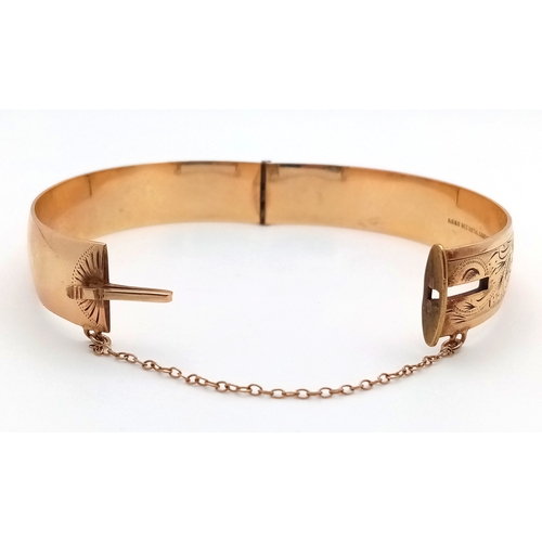 43 - A Vintage 9K Gold (Metal Core) Bangle. 13mm width. Clip open design. Safety chain. 27.5g total weigh... 