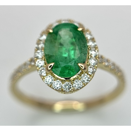 51 - A 14K Yellow Gold Emerald and Diamond Dress Ring. 1.49ct high grade emerald with a 0.43ctw diamond s... 