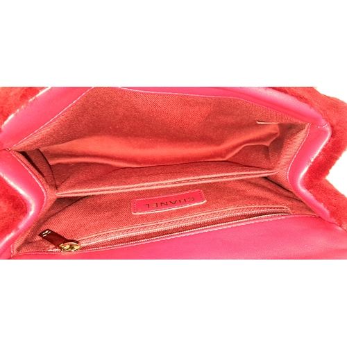 54 - A Chanel Burgundy Shearling Coco Top Handle Bag. Burgundy textile exterior with gold tone hardware, ... 