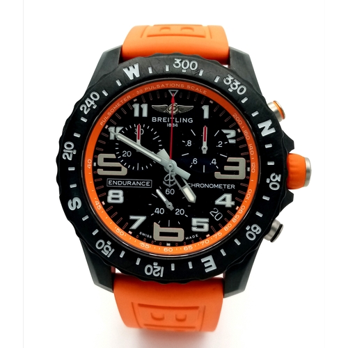 57 - A Breitling Endurance Pro Chronograph Gents Watch. Model WG00244. Orange rubber strap. Black titaniu... 