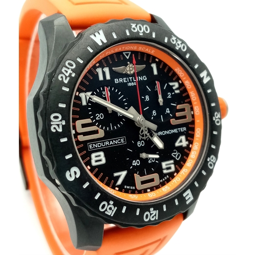 57 - A Breitling Endurance Pro Chronograph Gents Watch. Model WG00244. Orange rubber strap. Black titaniu... 