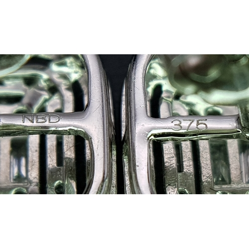 93 - A Pair of 9K White Gold Diamond Dress Earrings. c2ctw of round and baguette cut diamonds. Square stu... 