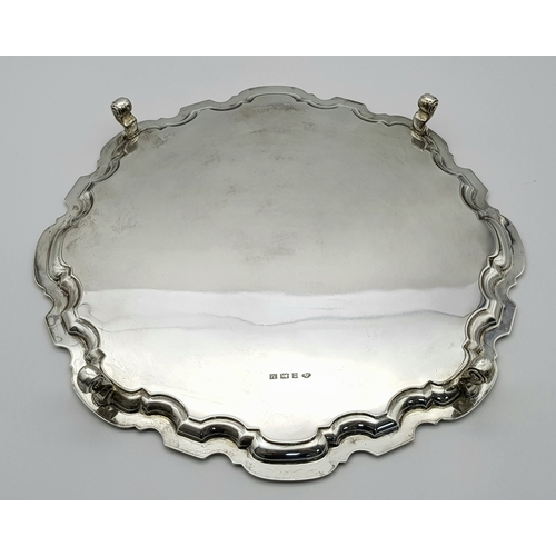 95 - A SOLID SILVER SALVA HAVING A 1961 BIRMINGHAM HALLMARK .       0.86Kilo       32cms DIAMETER