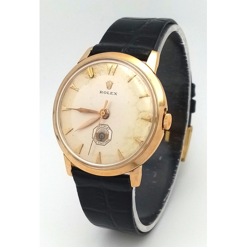 157 - A Rare Vintage Rolex Optimist International Gold Cased Watch. Black leather strap. Gold case - 34mm.... 