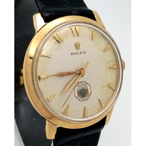 157 - A Rare Vintage Rolex Optimist International Gold Cased Watch. Black leather strap. Gold case - 34mm.... 