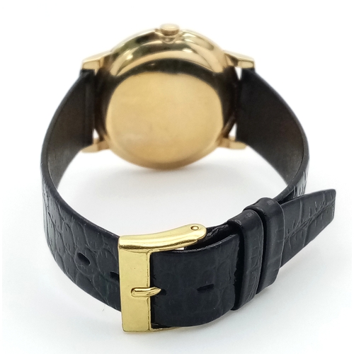 157 - A Rare Vintage Rolex Optimist International Gold Cased Watch. Black leather strap. Gold case - 34mm.... 