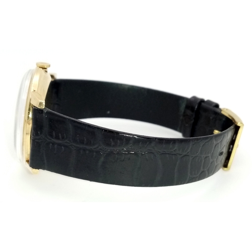 157 - A Rare Vintage Rolex Optimist International Gold Cased Watch. Black leather strap. Gold case - 34mm.... 