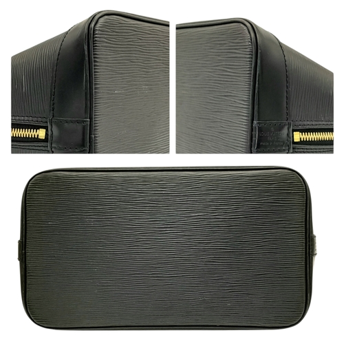 194 - A Louis Vuitton Black Epi Leather Alma PM Bag. Black Epi leather exterior with gold-tone hardware, d... 