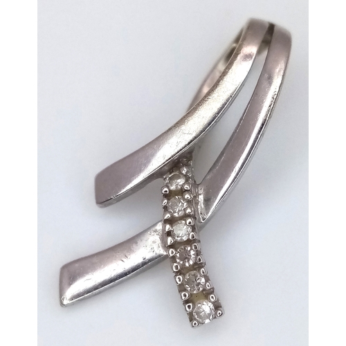 507 - A 9K White Gold Diamond Crossover Pendant. 2cm. 0.6g.