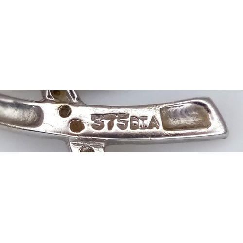 507 - A 9K White Gold Diamond Crossover Pendant. 2cm. 0.6g.
