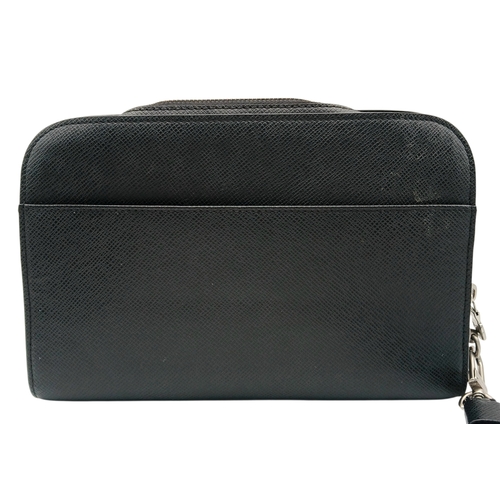 509 - A Louis Vuitton Taiga Baikal Leather Clutch Bag. Black leather exterior with silver-tone hardware, a... 