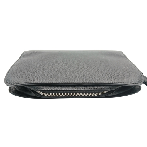 509 - A Louis Vuitton Taiga Baikal Leather Clutch Bag. Black leather exterior with silver-tone hardware, a... 