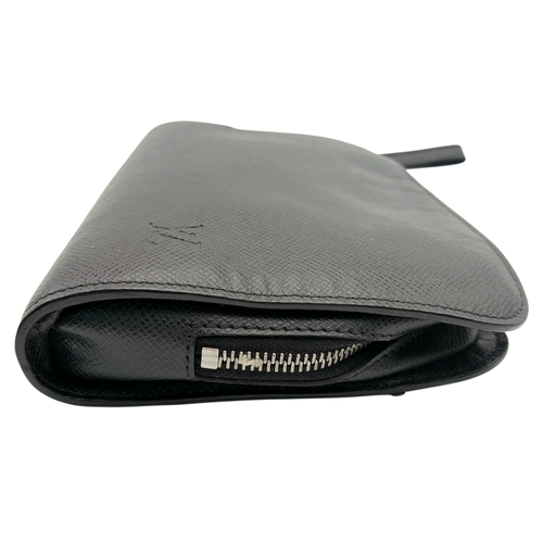 509 - A Louis Vuitton Taiga Baikal Leather Clutch Bag. Black leather exterior with silver-tone hardware, a... 