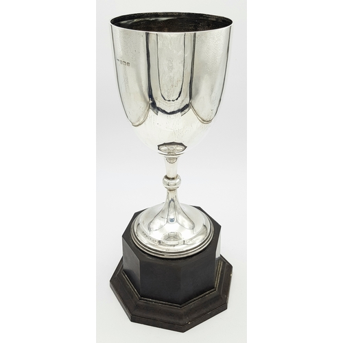 514 - A Sterling Silver Cup Mounted on a Wood Base. Hallmarks for Birmingham 1920. Makers mark of Edgar an... 