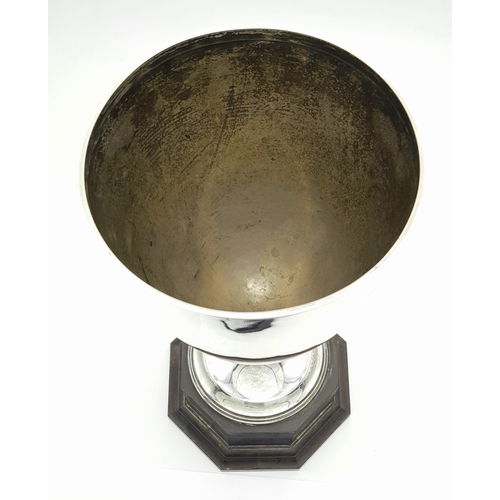 514 - A Sterling Silver Cup Mounted on a Wood Base. Hallmarks for Birmingham 1920. Makers mark of Edgar an... 