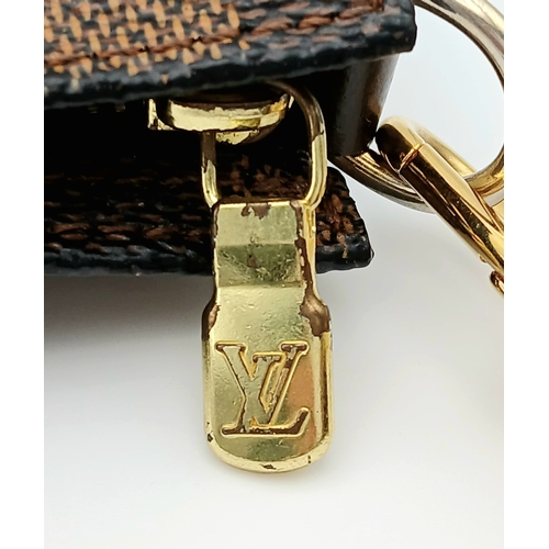 516 - A Louis Vuitton Brown Damier Ebene Pochette Accessoires. Brown Damier Ebene coated canvas exterior w... 