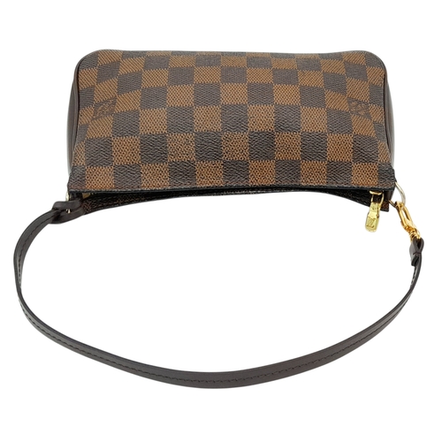 516 - A Louis Vuitton Brown Damier Ebene Pochette Accessoires. Brown Damier Ebene coated canvas exterior w... 