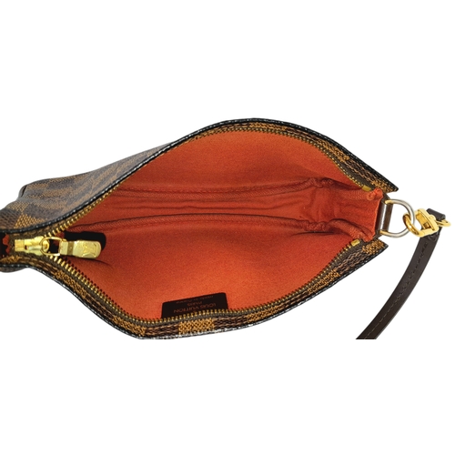 516 - A Louis Vuitton Brown Damier Ebene Pochette Accessoires. Brown Damier Ebene coated canvas exterior w... 
