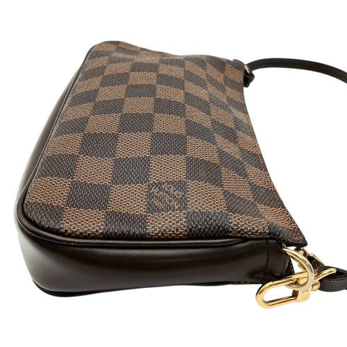516 - A Louis Vuitton Brown Damier Ebene Pochette Accessoires. Brown Damier Ebene coated canvas exterior w... 