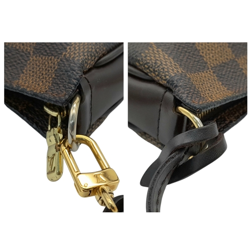 516 - A Louis Vuitton Brown Damier Ebene Pochette Accessoires. Brown Damier Ebene coated canvas exterior w... 