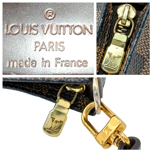 516 - A Louis Vuitton Brown Damier Ebene Pochette Accessoires. Brown Damier Ebene coated canvas exterior w... 