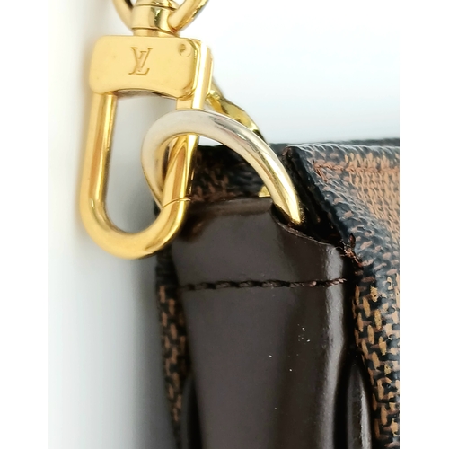 516 - A Louis Vuitton Brown Damier Ebene Pochette Accessoires. Brown Damier Ebene coated canvas exterior w... 